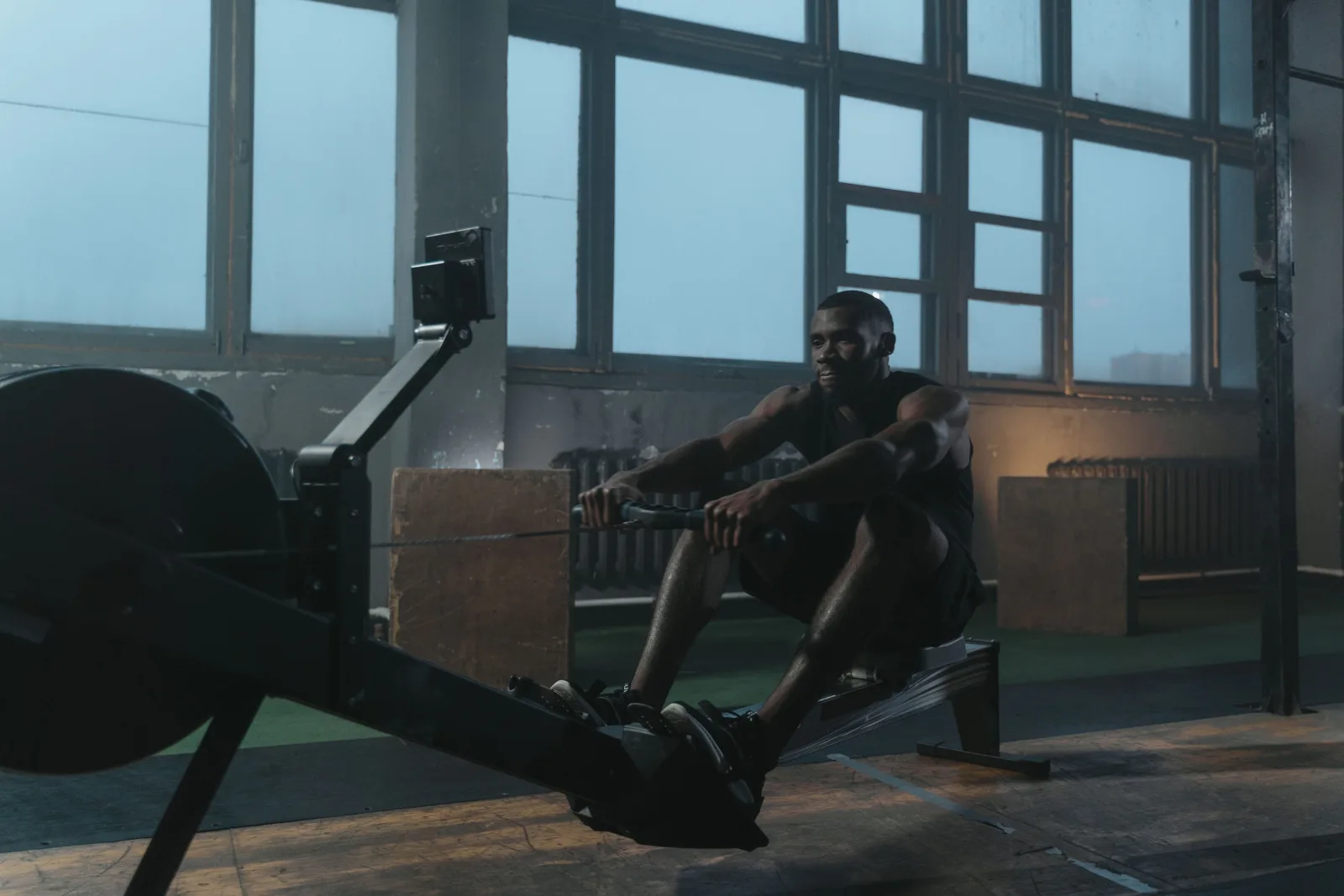 Athlete on a rowing machine in a gym